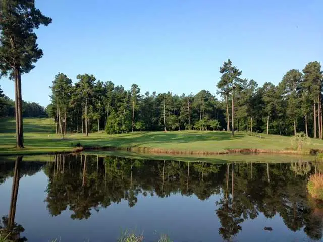 Overview of a pond and hole at Pointe South Golf Course
